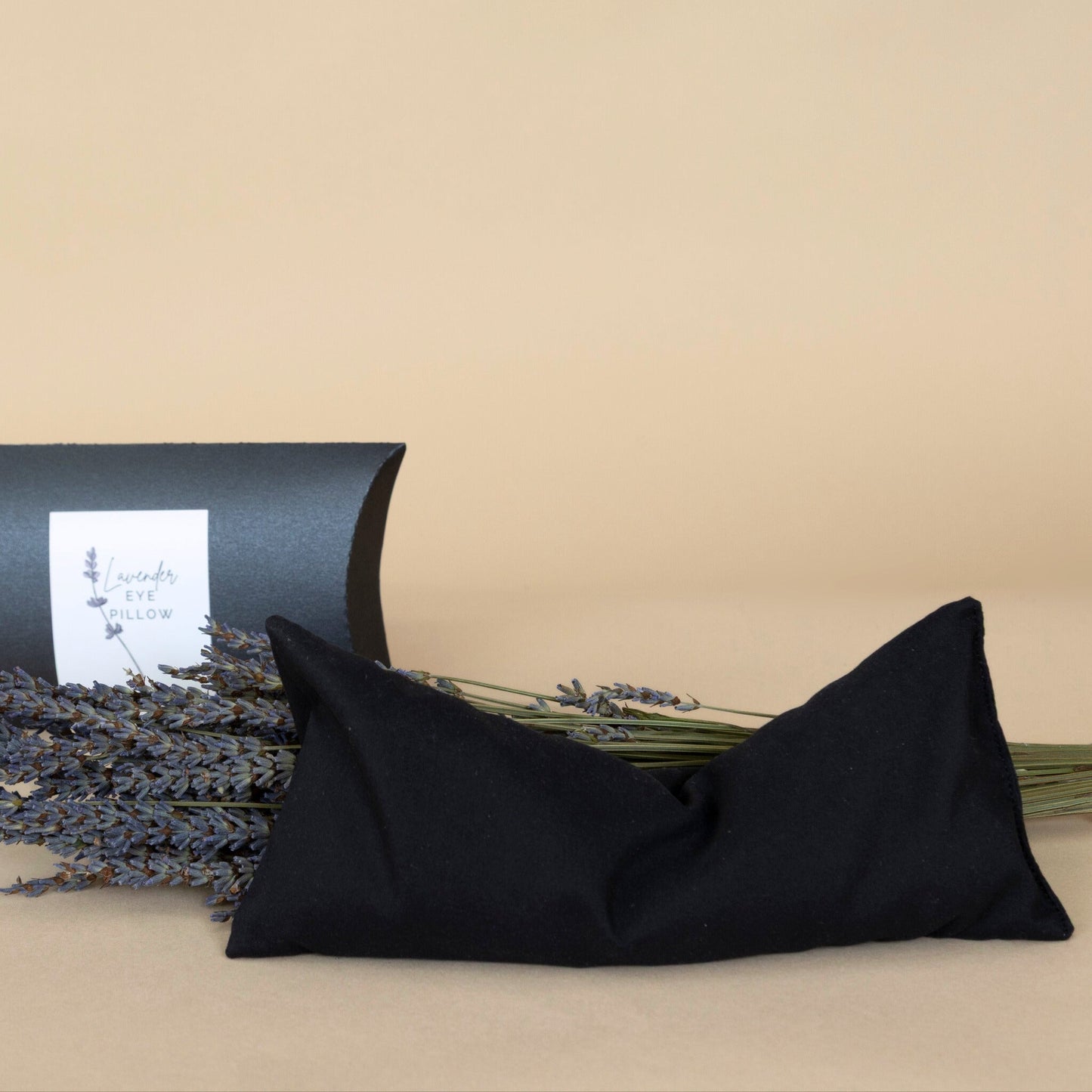 Lavender Eye Pillow in sleek black color, pictured ready for calming aromatherapy sessions.