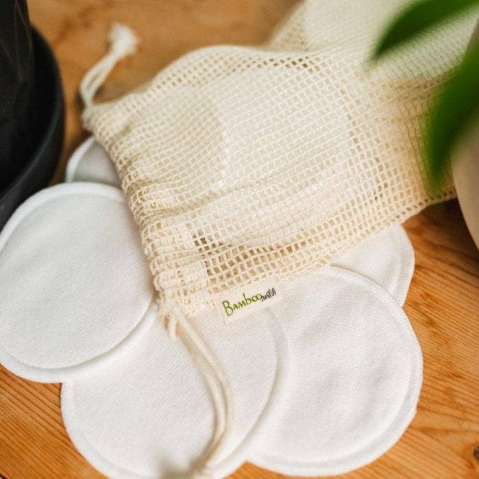 Reusable Facial Rounds featuring bamboo cotton material arranged with a cotton pouch for sustainable skincare routines.