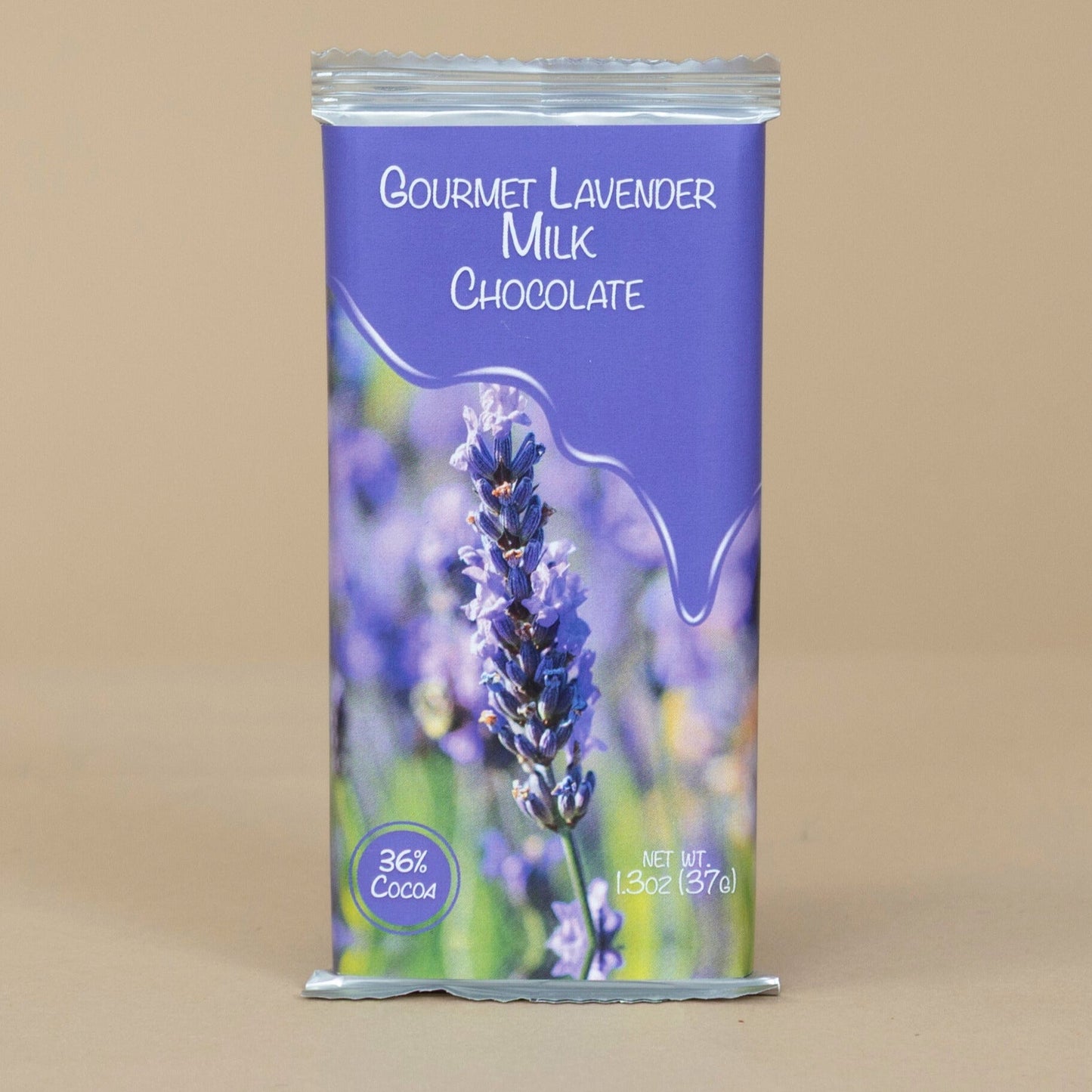 Gourmet Lavender Milk Chocolate bar beautifully displayed with lavender sprigs accentuating the creamy chocolate texture.