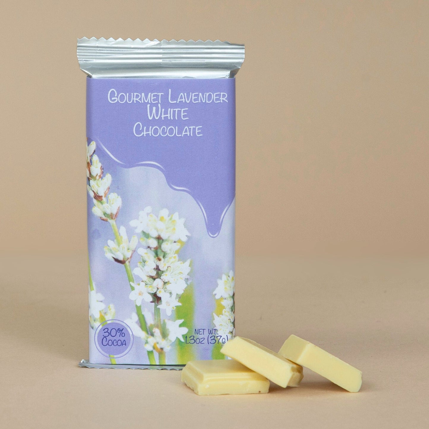 Gourmet Lavender White Chocolate squares presented on a ceramic plate with delicate lavender flowers