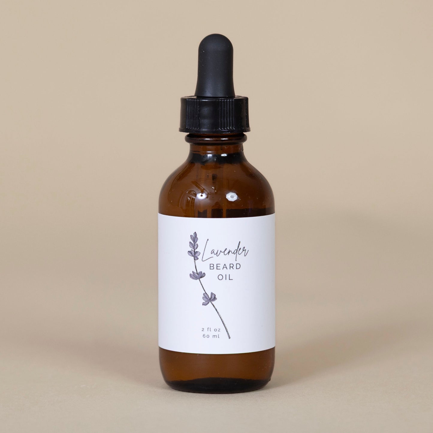 Lavender Beard Oil in a brown glass bottle with dropper, displayed on a beige background for a premium grooming touch