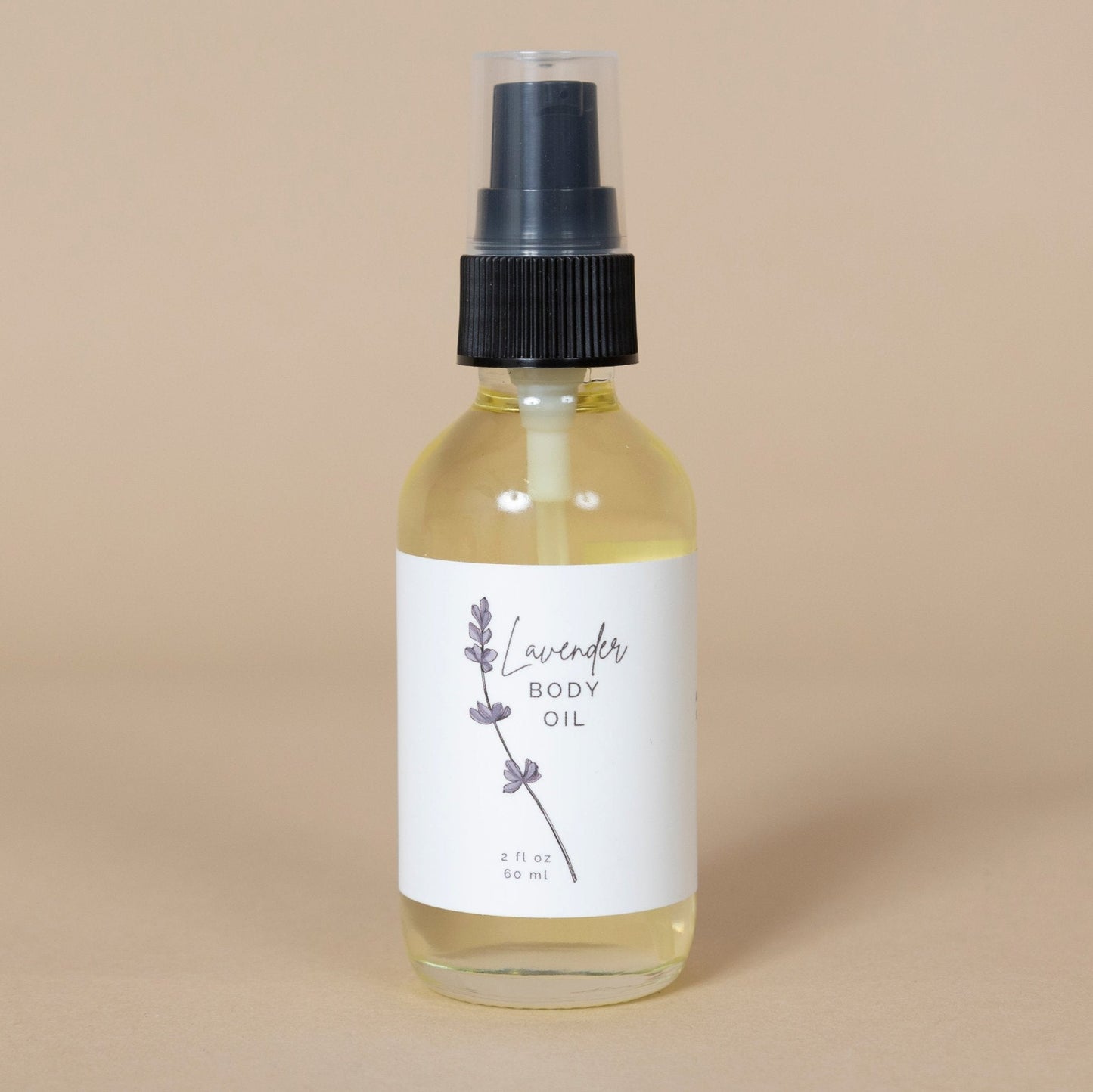 Lavender Body Oil elegantly displayed on a spa towel, perfect for relaxing self-care routines