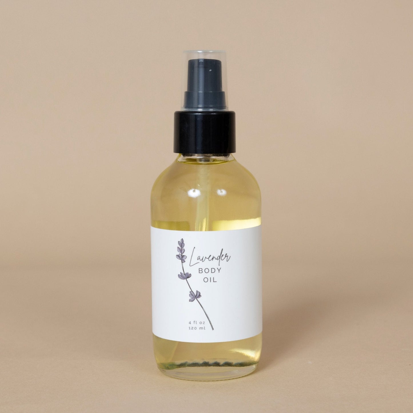 Lavender Body Oil showcased with soothing droplets, emphasizing its nourishing, moisturizing formula