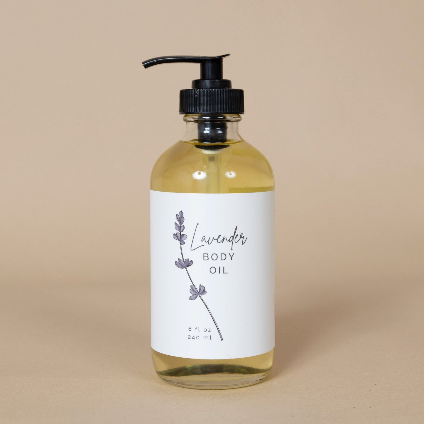 Lavender Body Oil bottle set against a serene background, capturing the natural, luxurious experience