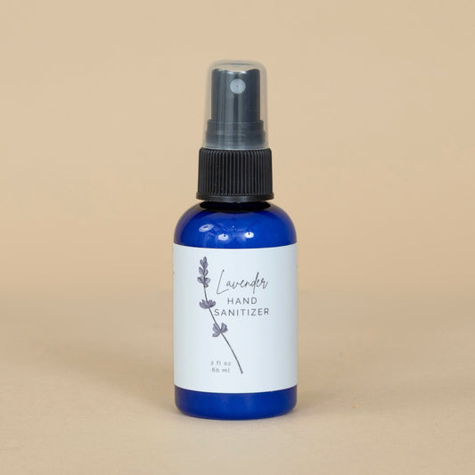 Lavender Hand Sanitizer shown beside fresh lavender flowers emphasizing its soothing, natural scent.