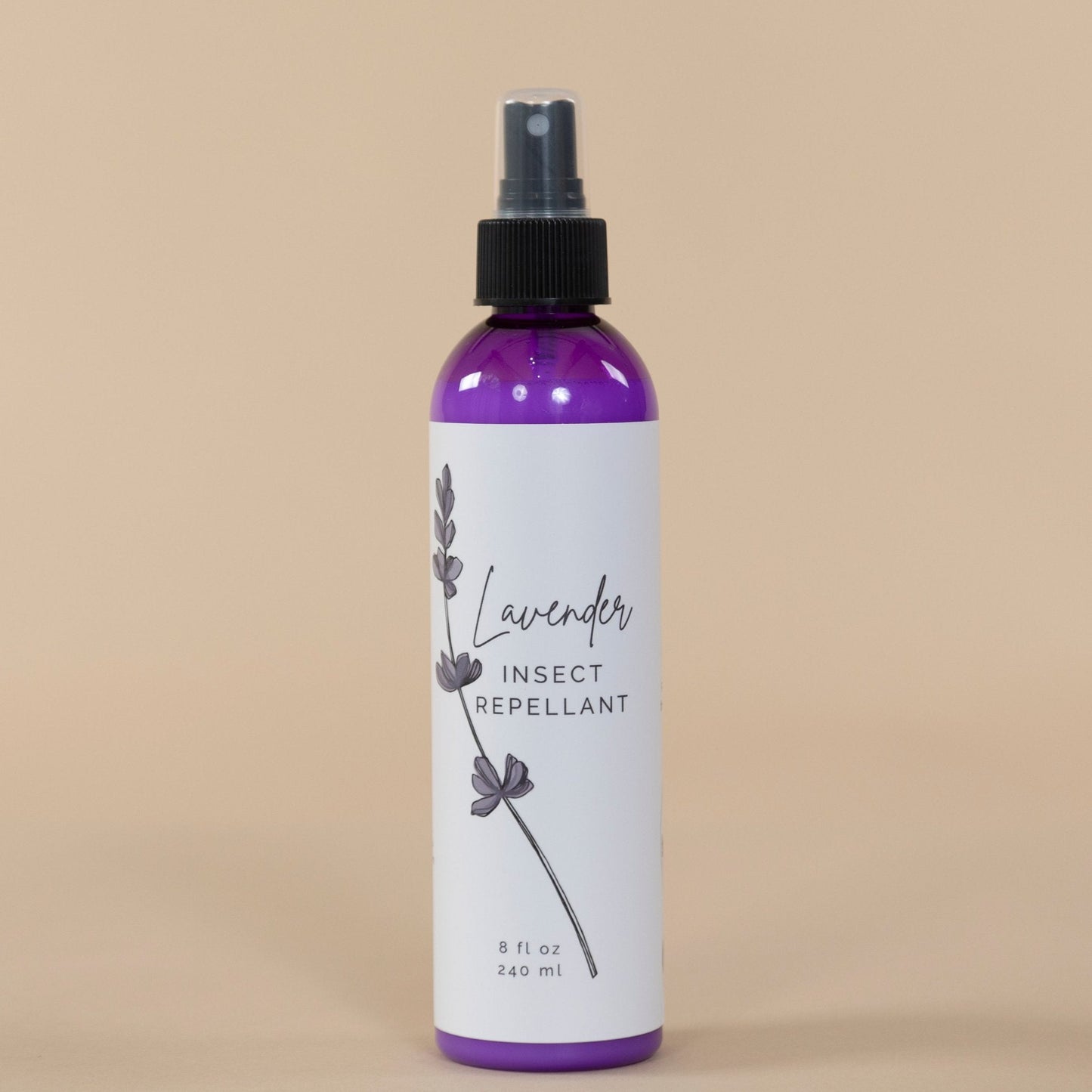 Lavender Insect Repellant packaging featuring elegant label design alongside blooming lavender plants