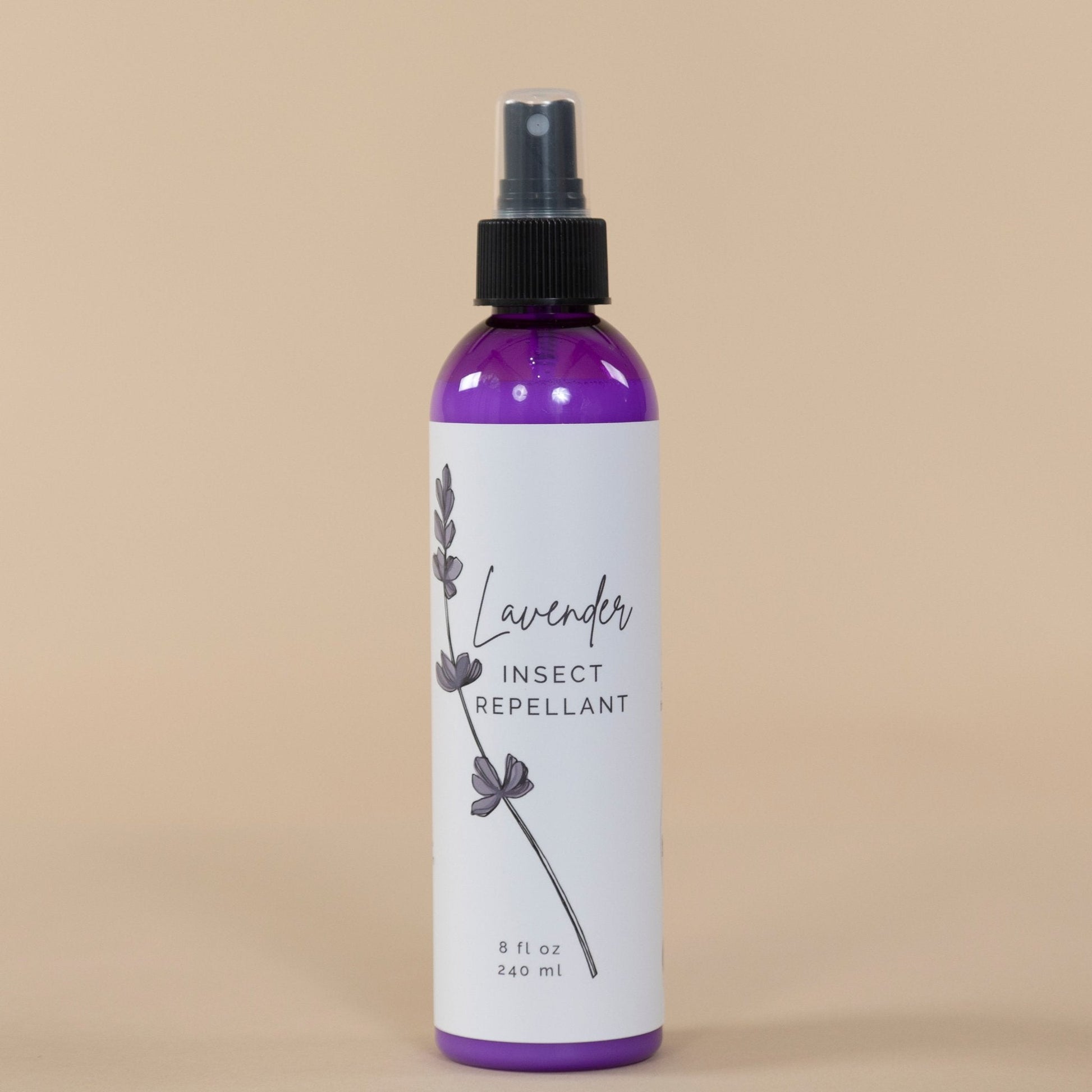 Lavender Insect Repellant packaging featuring elegant label design alongside blooming lavender plants