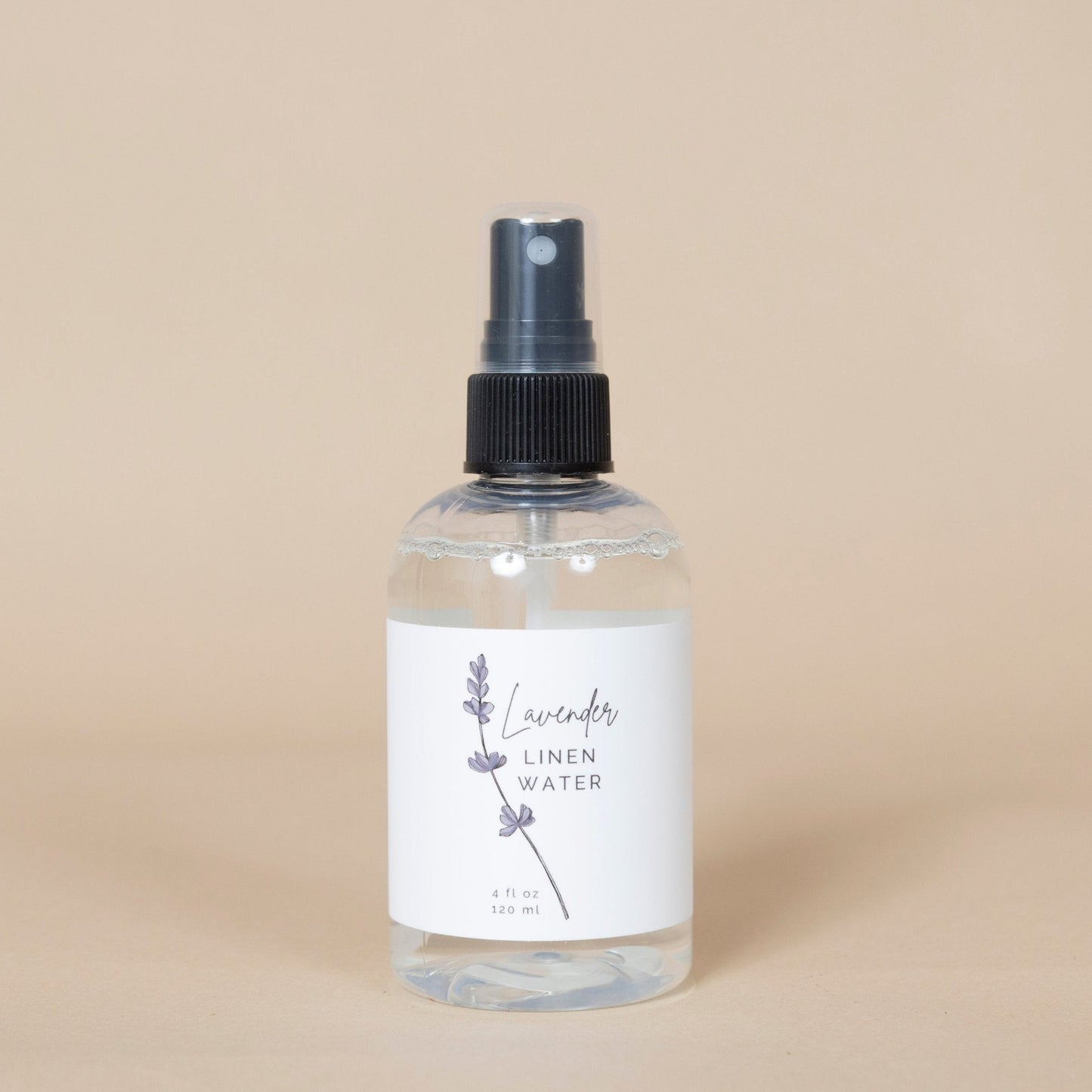 Lavender Linen Water product shown with purple lavender flowers, highlighting its calming effect