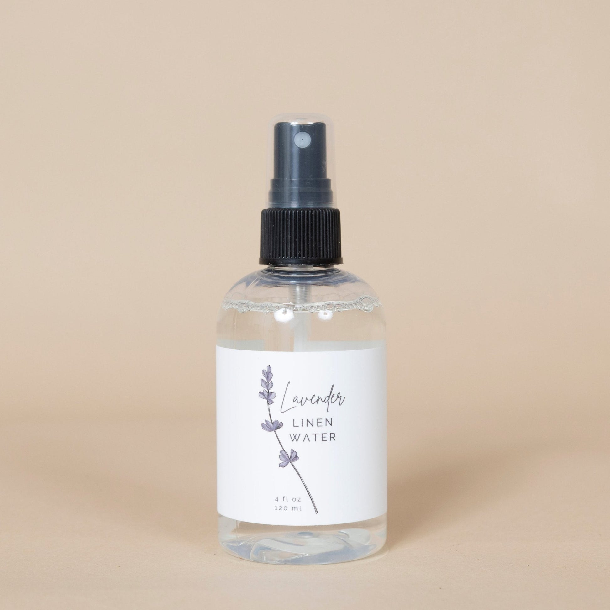 Lavender Linen Water product shown with purple lavender flowers, highlighting its calming effect