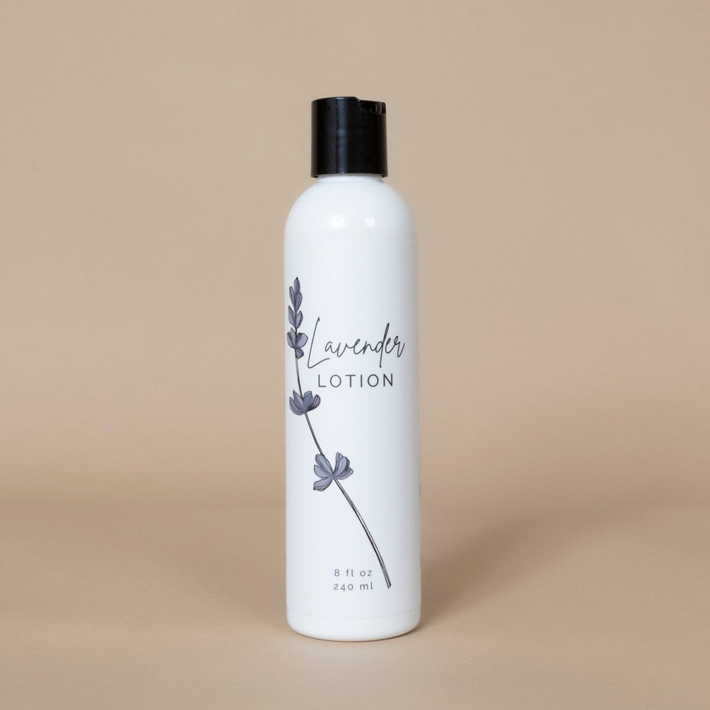 Lavender Lotion in a purple bottle for all skin types on a marble countertop