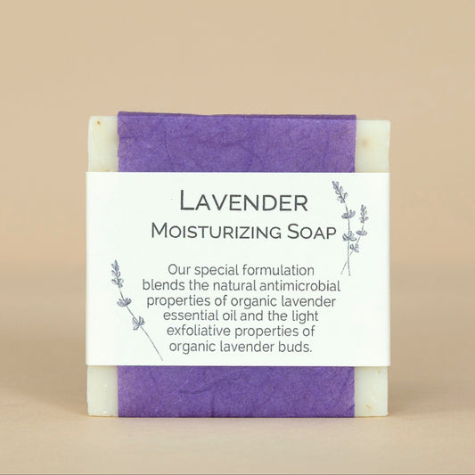 Lavender Moisturizing Soap large bar shown with delicate lavender blossoms, highlighting its gentle moisturizing formula.