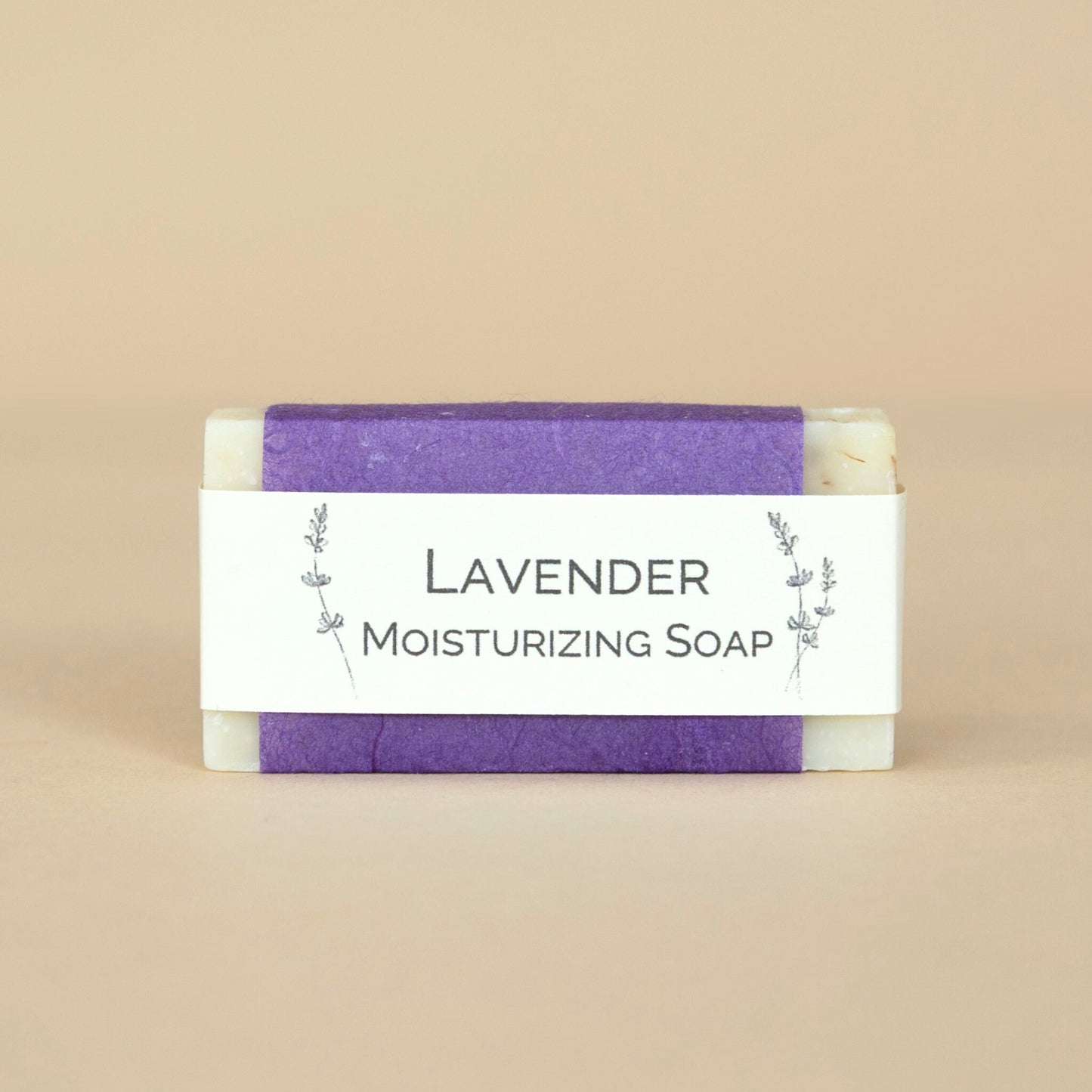 Lavender Moisturizing Soap small bar showcased on a clean surface, highlighting its gentle hydrating formula.