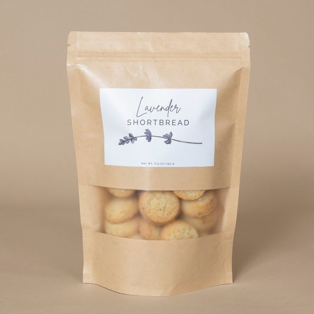 Lavender Shortbread delicately arranged on a rustic wooden tray, showcasing its buttery texture and floral accents.