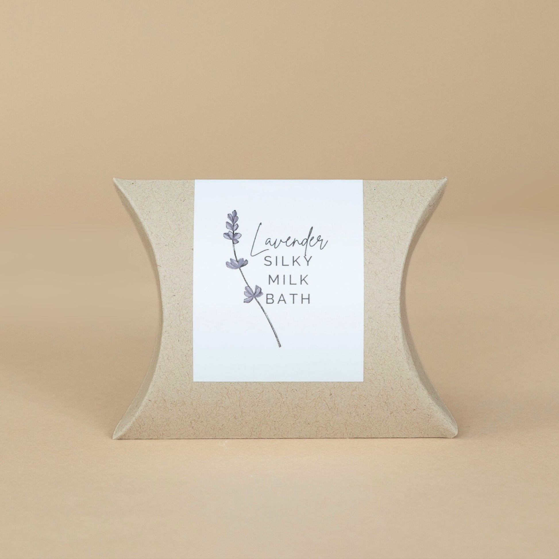 Lavender Silky Milk Bath jar opened to show the luxurious powder texture surrounded by natural spa elements.