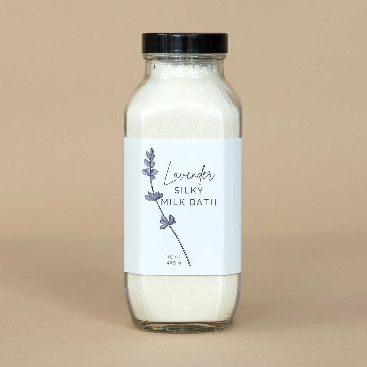 Lavender Silky Milk Bath with its soothing lavender hues placed on a marble surface for an elegant presentation.