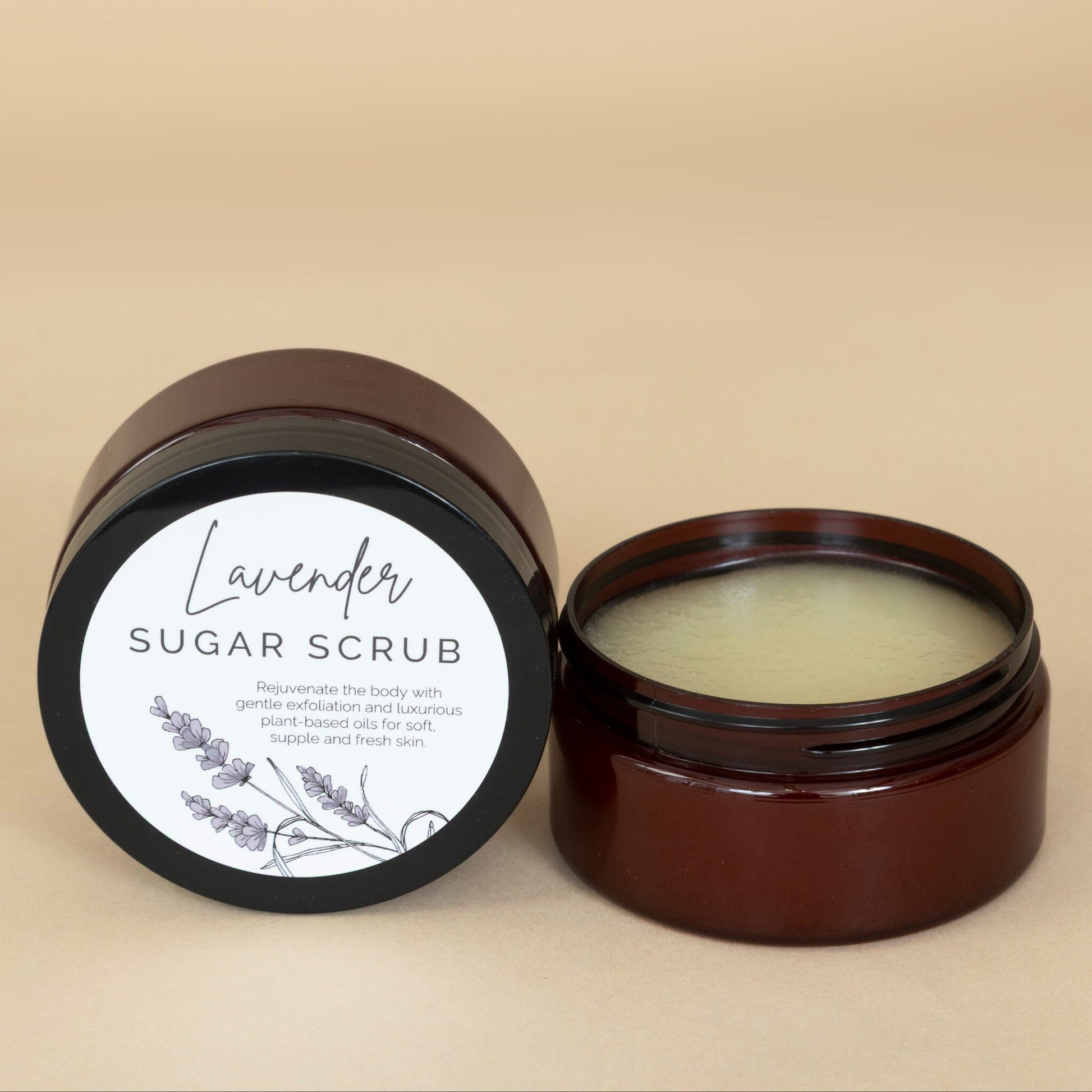 Lavender Sugar Scrub in a clear jar with visible natural exfoliating crystals and lavender buds
