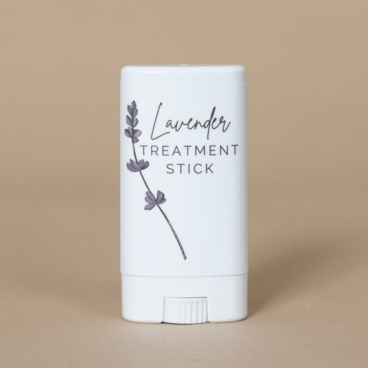 Lavender Treatment Stick shown uncapped to highlight the balm texture and elegant, travel-friendly design.
