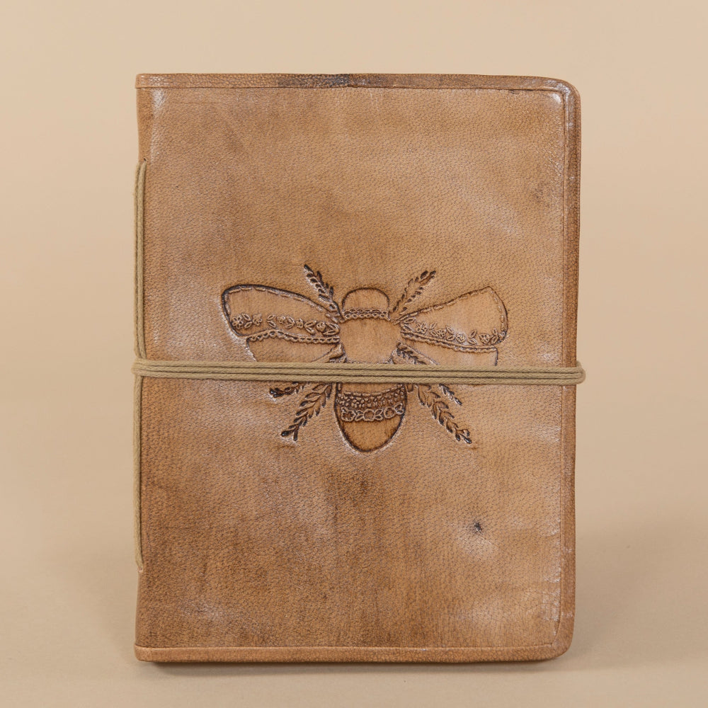 Leather Bee Journal featuring a lavender bee embossed design on the cover, showcasing intricate craftsmanship and vivid color.