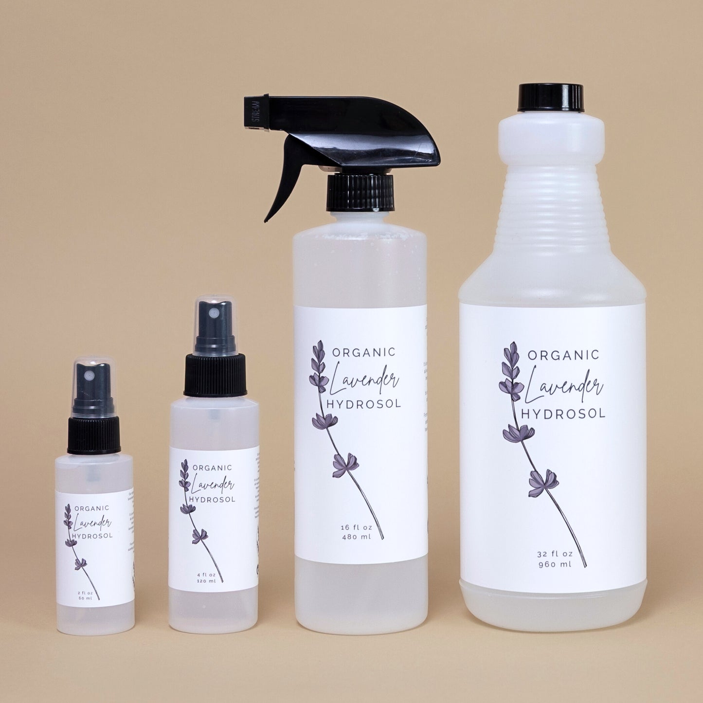 Frosted white bottle of organic lavender hydrosol on a beige background