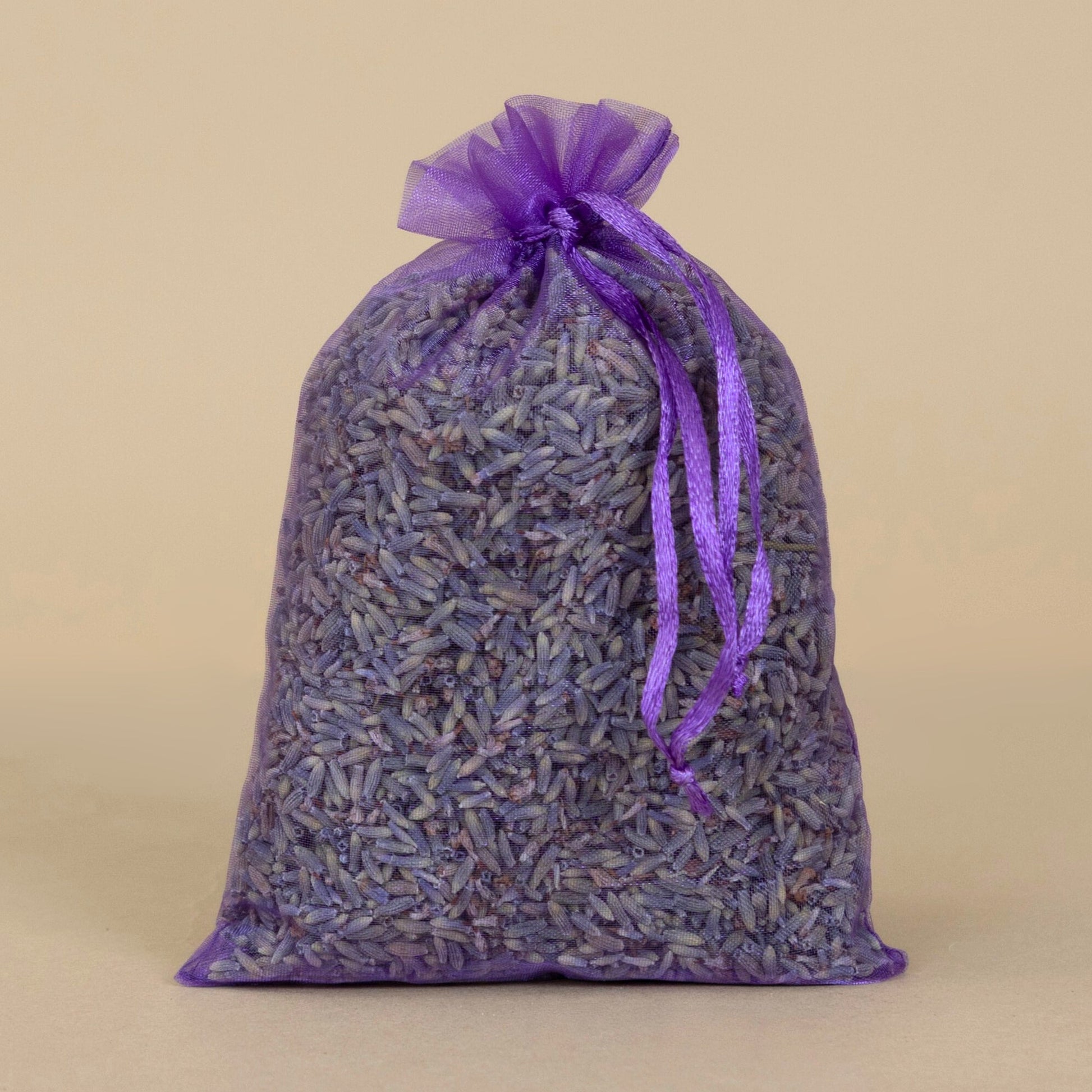 Organic Lavender Sachet - large displayed in a purple bag, showcasing aromatic dried lavender flowers inside.