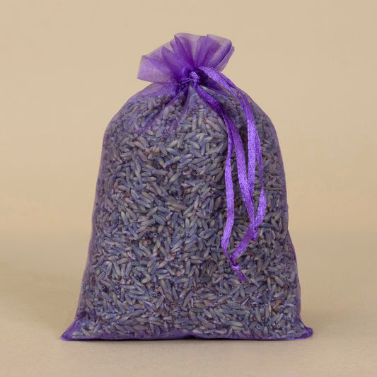 Organic Lavender Sachet - large displayed in a purple bag, showcasing aromatic dried lavender flowers inside.