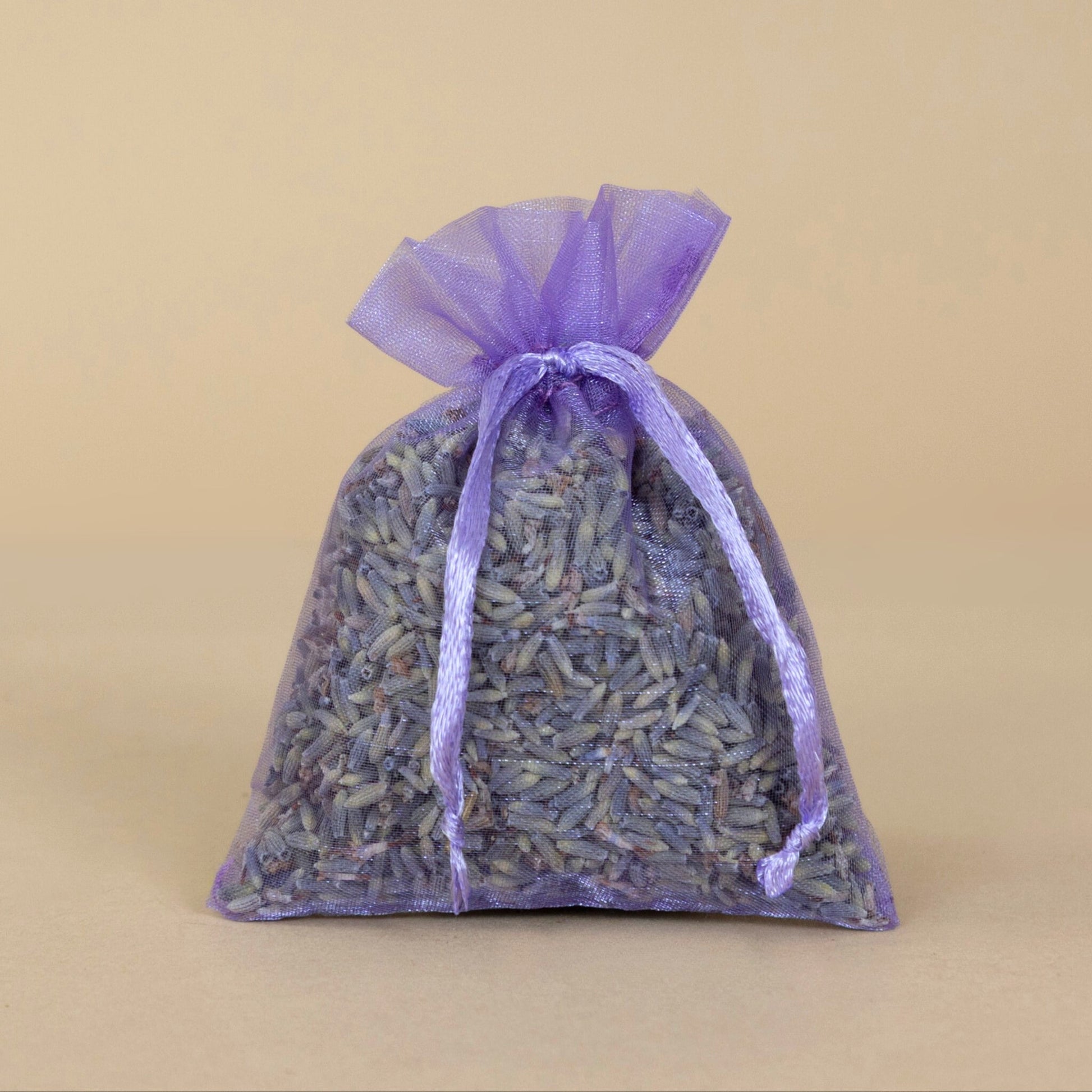 Organic Lavender Sachet - small displayed in a decorative purple bag, filled with fragrant dried lavender flowers.
