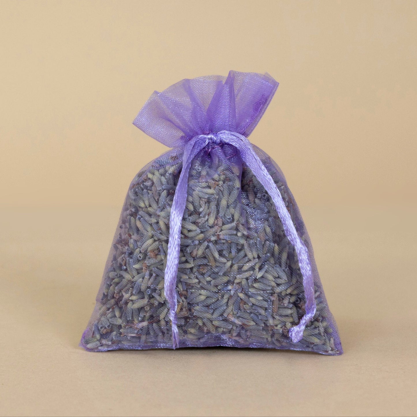 Organic Lavender Sachet - small displayed in a decorative purple bag, filled with fragrant dried lavender flowers.